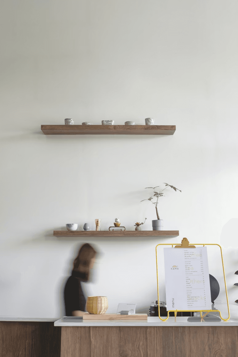 Cafe interior with shelves of beverages